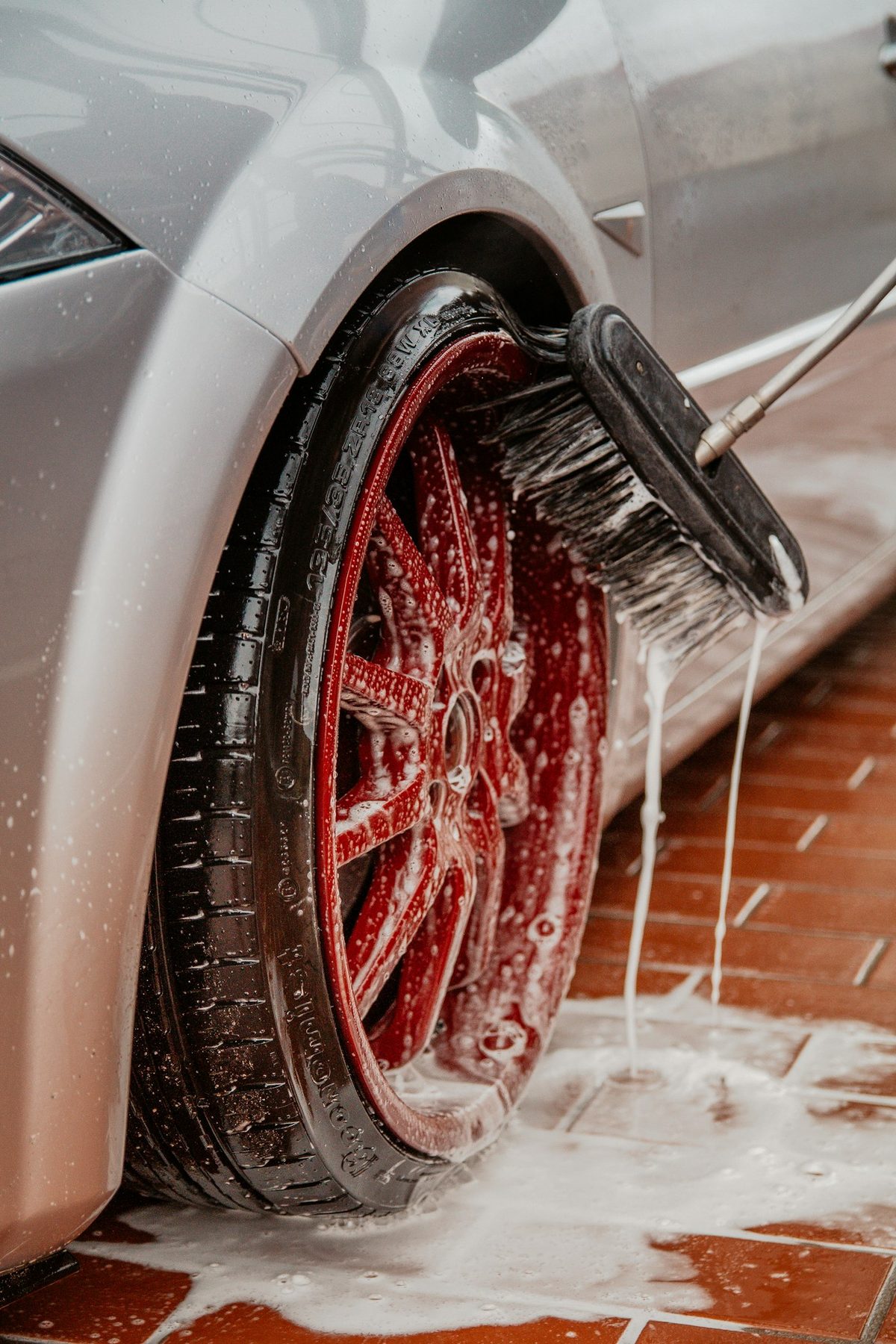 Wheel being cleaned during an exterior detail
